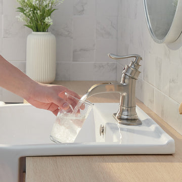 Waterfall Single Hole Single-Handle Low-Arc Bathroom Faucet with Pop-up Drain Assembly in Brushed Nickel